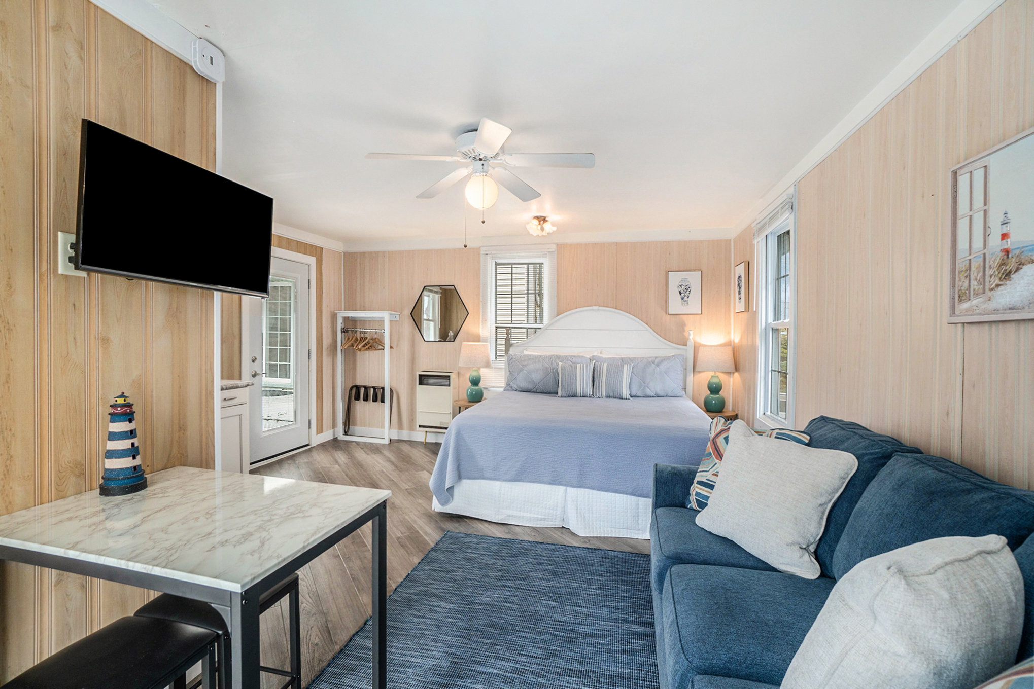 king bed, sleeper sofa and high top table