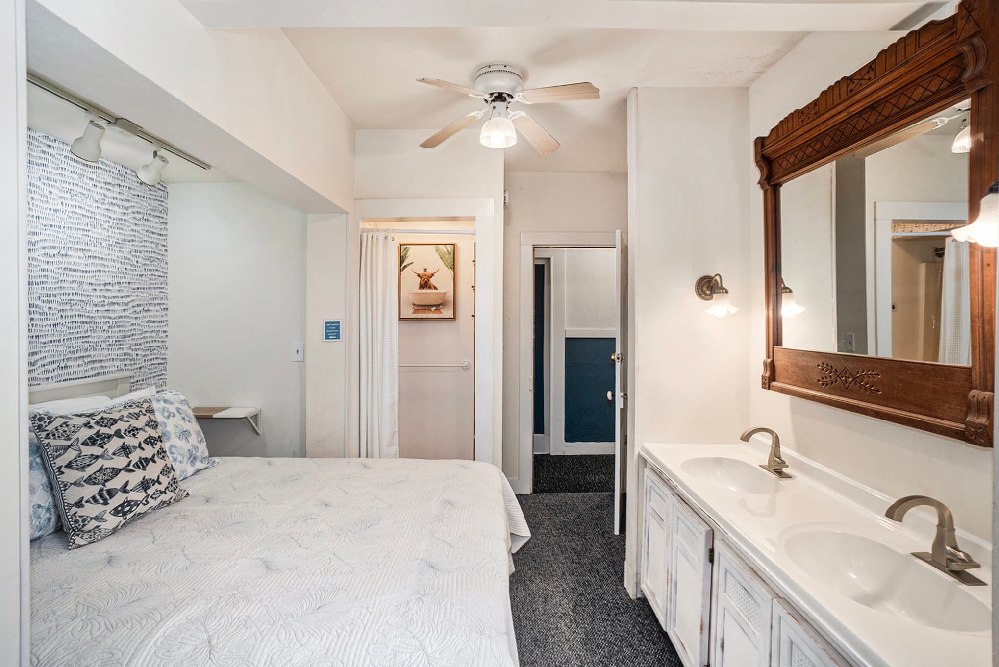 queen bed, vanity and shower