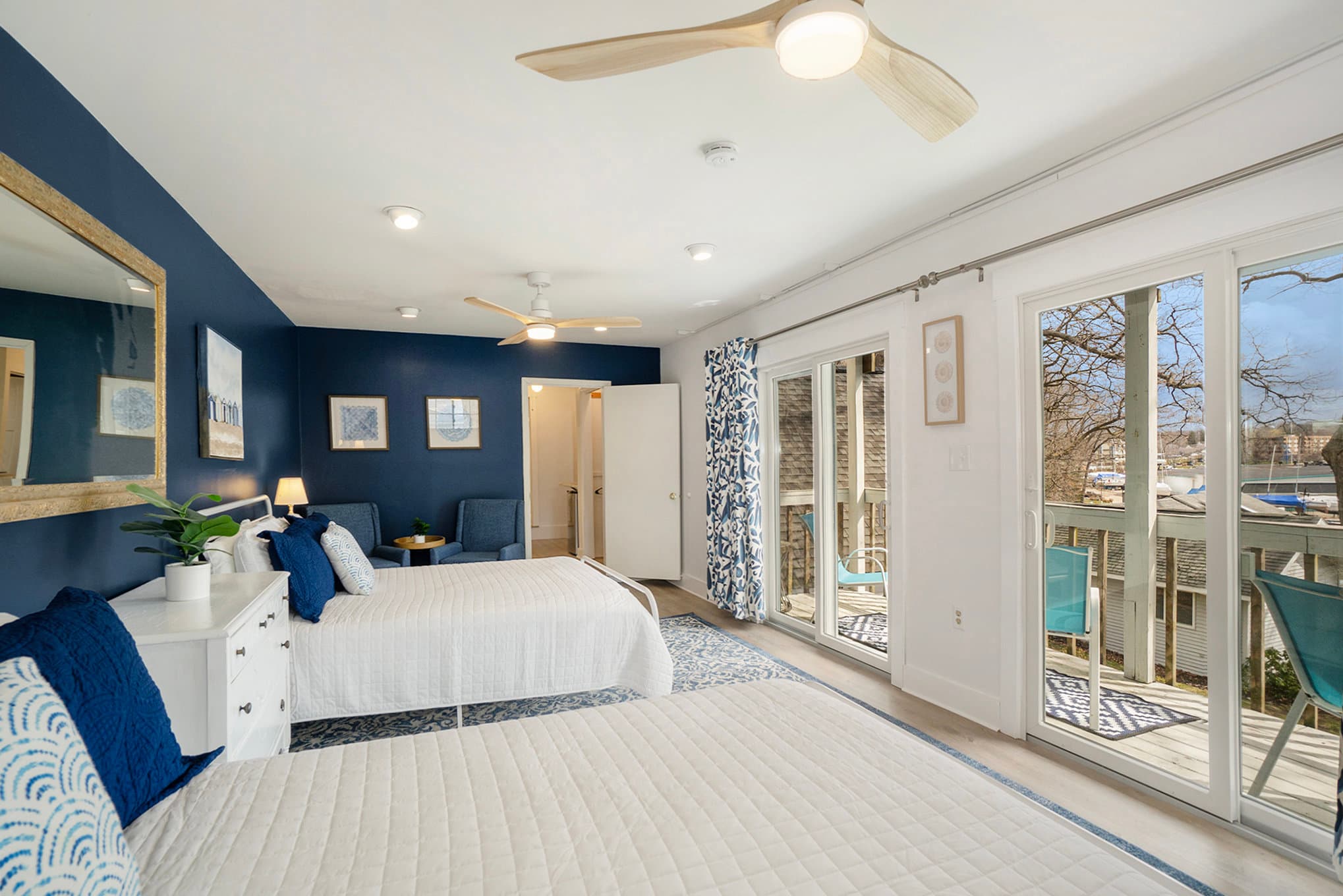 two queen beds and view of balcony