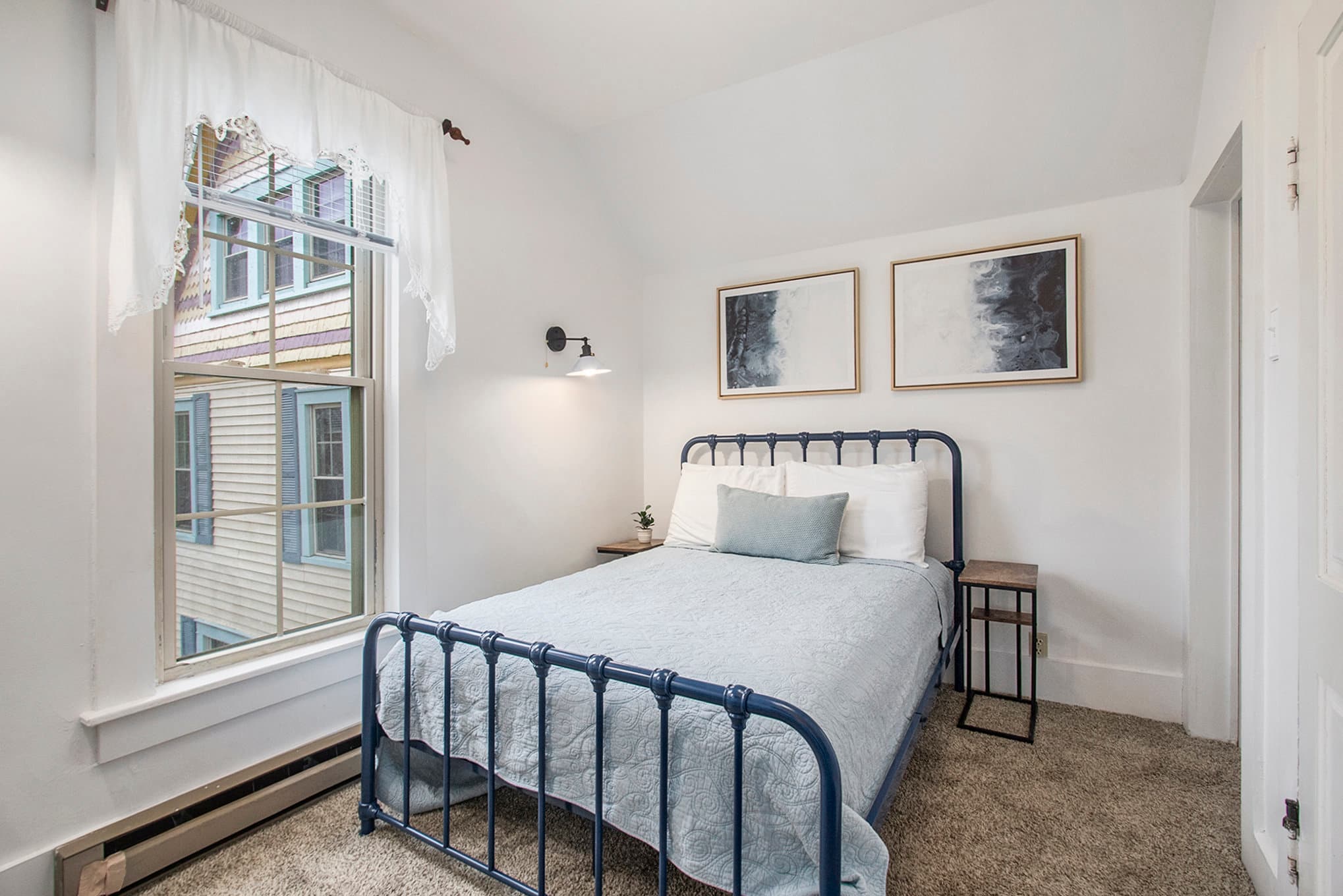 Bedroom 2 full bed with small corner sink and flat screen tv