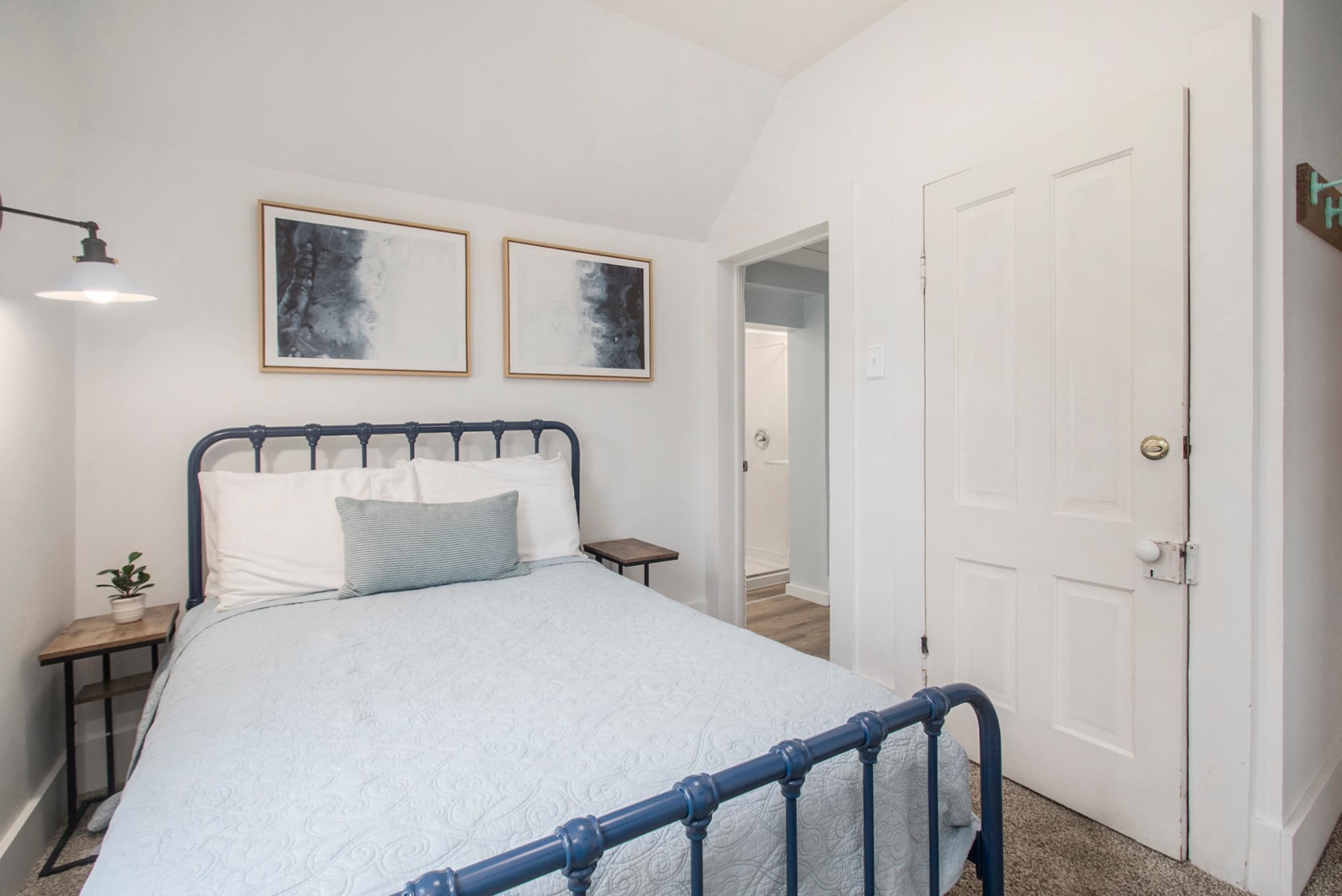 Bedroom 2 full bed view into bathroom