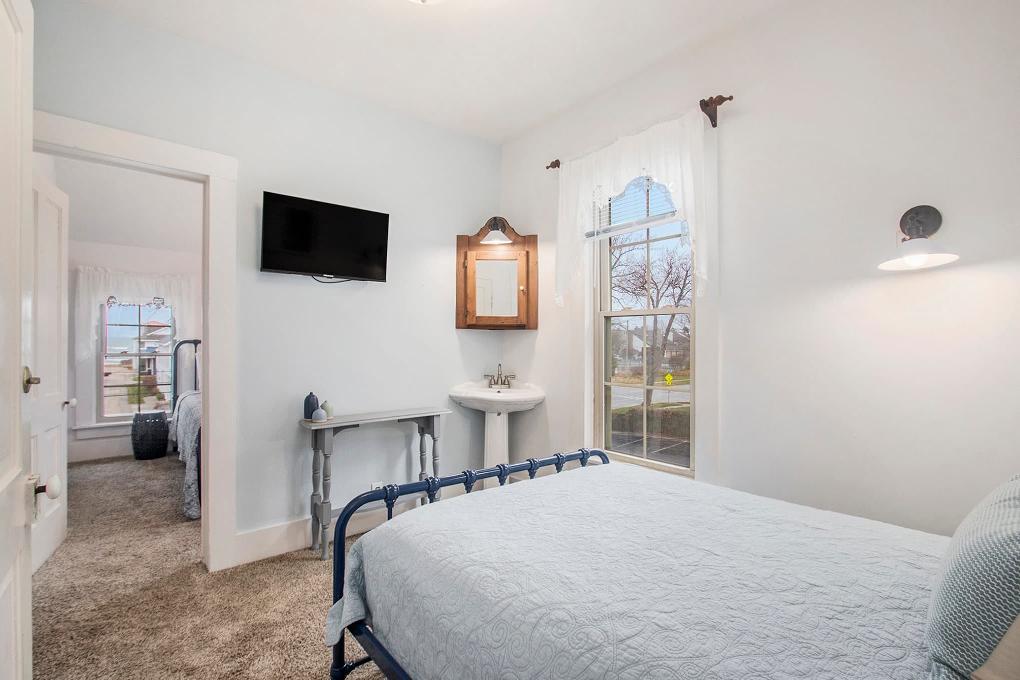 full bed with view through suite