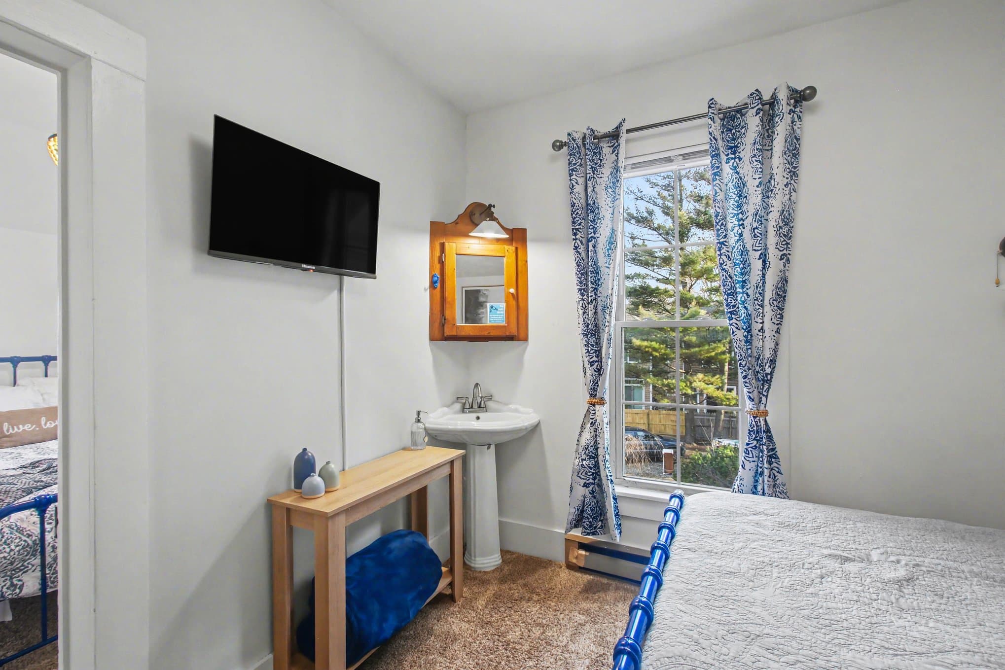 full bed with view through suite