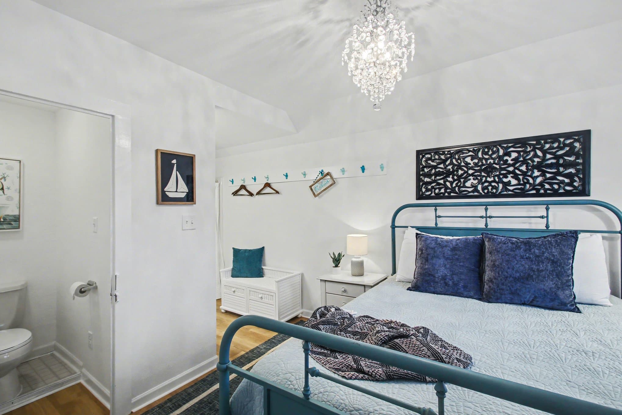 queen bed and chandelier