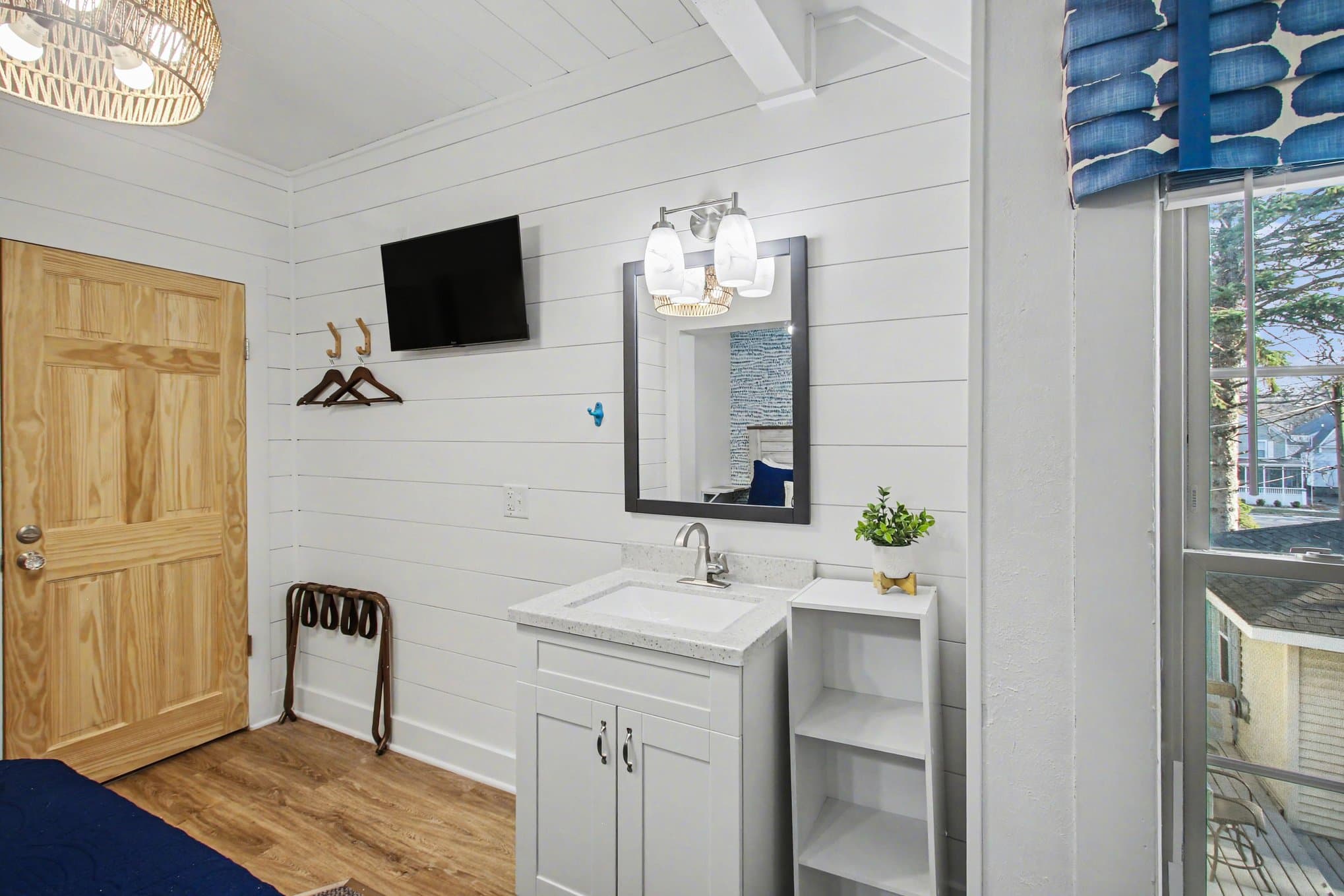 vanity, tv, window overlooking marina