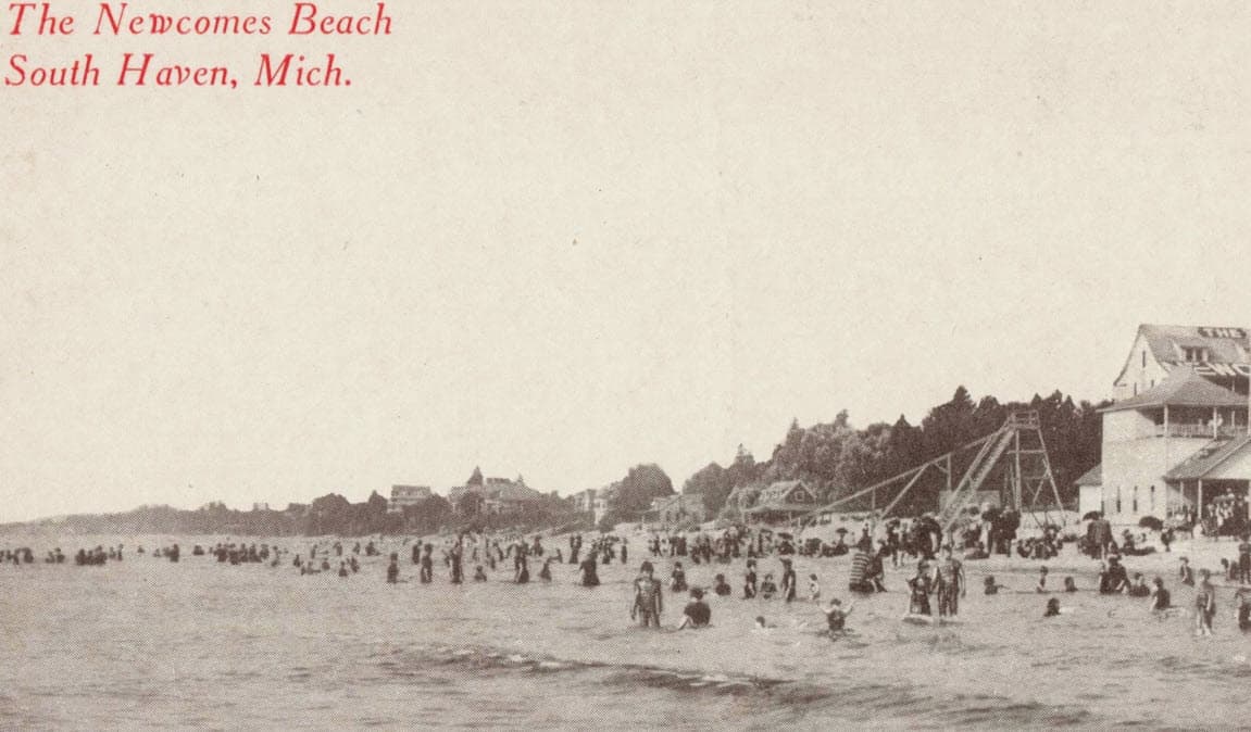 A vintage image of Newcomes Beach in South Haven, Michigan, bustling with people enjoying the water and sand. A vintage image of Newcomes Beach in South Haven, Michigan, bustling with people enjoying the water and sand.